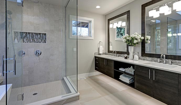 Modern bathroom conversion with double vanity and glass shower