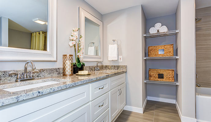 bathroom with long white vanity cabinet