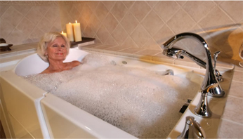 Older Woman enjoying her remodeled tub & bathroom