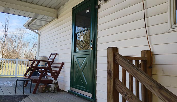 Steel door installed at front porch of a house