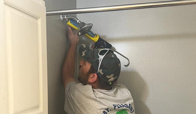 A person is installing shower