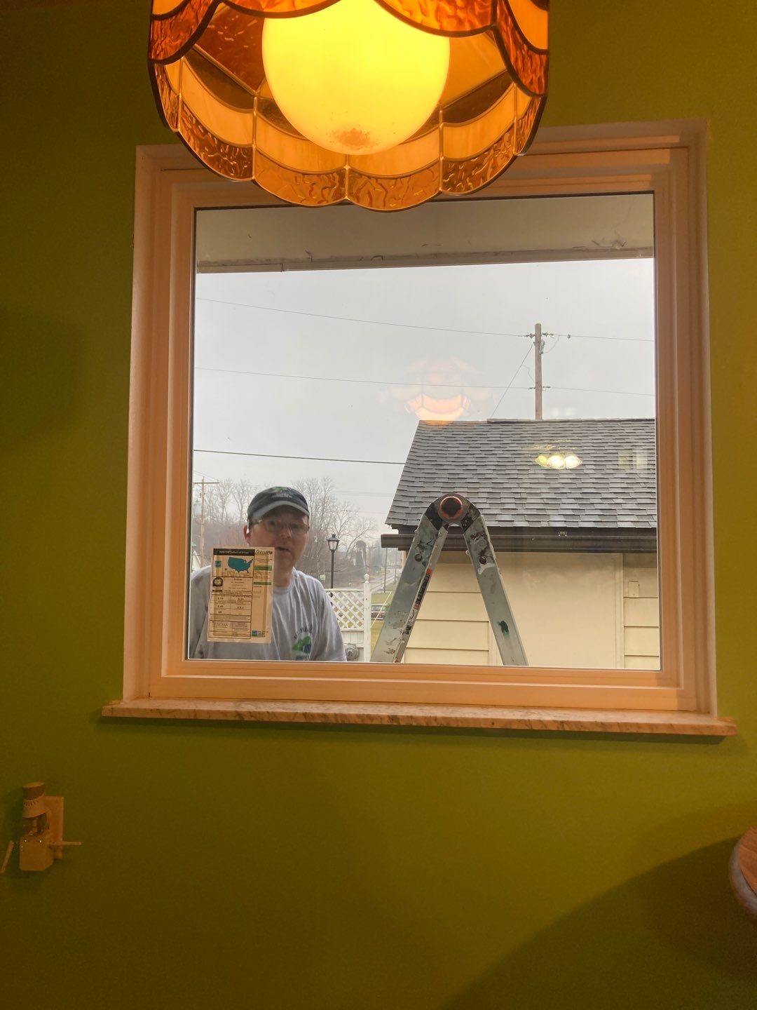New Picture Window in Bradenville with Installer Joe looking in!