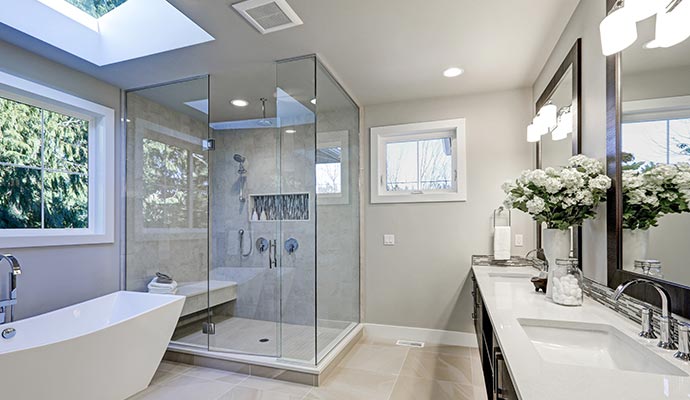 Modern bathroom with glass shower and freestanding bathtub