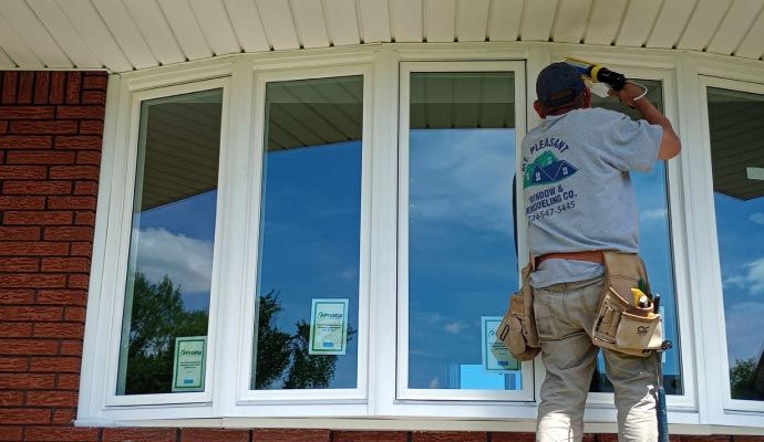 Person installing bay window