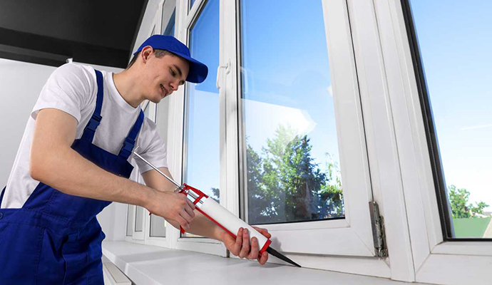 Technician inspecting window material