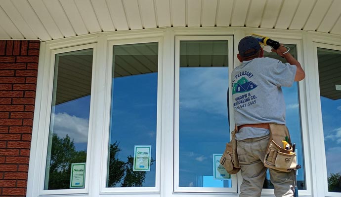 Technician installing window